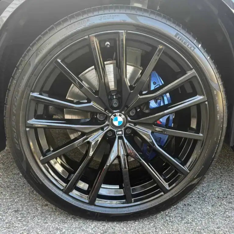 Black BMW wheel with a blue brake caliper